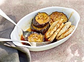 Candied eggplant with pork in serving dish