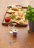 Puff pastry with spinach and ricotta filling in serving tray