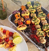 Different barbecue skewers on grill pan