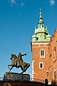 View of monument and Wawel Royal Castle church tower in Krakow, Poland