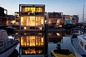 Illuminated view of Waterwoningen, IJburg, Amsterdam, Netherlands