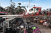 Bicycles parking at main station of old ferry, Amsterdam, Netherlands