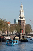 View of Oude Kerk and Floating Dutchman in Oudeschans, Amsterdam, Netherlands
