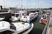 People on ferry boats at port in Oranjesluizen, Noord, Amsterdam, Netherlands