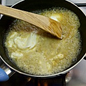 Close-up of fraiche cream being cooked in pan, step 3