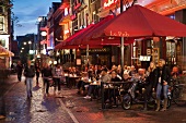 People at restaurants and bars in evening, Leidseplein, Amsterdam, Netherlands