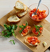 Pieces of tomato bruschetta on wooden board