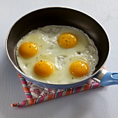 Egg being fried in pan, step 3