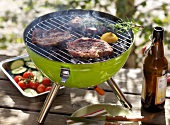 Neck steaks with rosemary and lemon on grill 