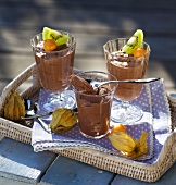 Chocolate mousse in glasses on serving tray