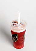 Bubble tea in disposable plastic cup with straw