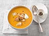 Bowl of sweet potato soup with chicken and cream