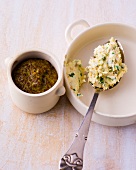 Bowl of coarse mustard and horseradish paste in baking dish