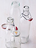Glass flip-top bottles and screw cap bottles