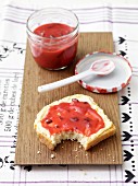 A slice of buttermilk bread spread with raspberry jam