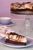 Piece of marble cheesecake on cake stand and plate