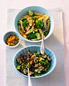 Lentil salad with mushrooms and pasta salad in bowls