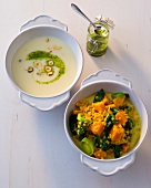 Cauliflower soup with lentils and spinach dal in bowls 