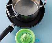 Close-up of kitchen utensils for cooking on blue background