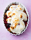 Close-up of amarettini berries with meringue topping in bowl