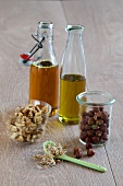 Oils, nuts and wheat germ in glass jars