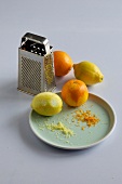 Lemons and oranges with grater
