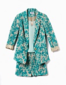 Floral pattern turquoise suit and teal tank top on white background