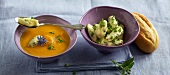 Carrot soup with herb dumplings in bowls 