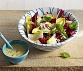 Radicchio chicory salad with cheese dressing in bowl