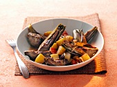 Artichokes with vegetables in bowl