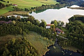 View of castle Hartmannsberg around Eggstatt Hemhofer Lake in Bavaria, Germany