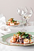Salted lambs with scallop salad on plate