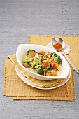 Sweet potato with tofu and broccoli curry in bowl