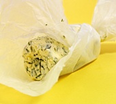 Herb butter wrapped in wax paper