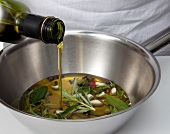 Oil being added to chopped ingredients in bowl for preparing wurzol, step 2