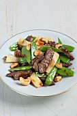 Stir-fried beef with bamboo shoots and mange tout