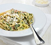 Pasta carbonara with herbs on plate