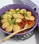 Tomatoes with cheese dumplings in bowl