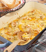 Chicken and peach gratin in serving dish