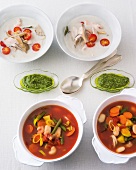 Thai soup and vegetable soup with pistou in bowls