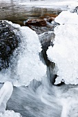 Close-up of frozen and flowing stream in Lapland, Finland