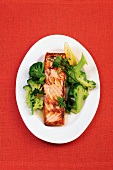 Salmon steak with broccoli on tray