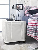 Cloth cabinet with casters, metal shelf lamp, alarm clock and tray