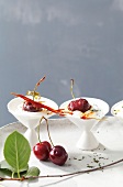 Two fresh goat cheese with caramelized cherries in bowl