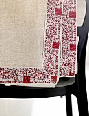 Linen tablecloth with border embroidered in red