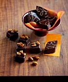 Bowl of lozenges fig and pine nut praline chocolates in bowl