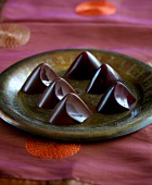 Honey chocolates in peak shape on plate