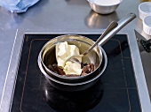 Melt butter and chocolate in bowl with hot water in saucepan