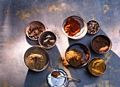 Spices and powder in bowls, overhead view