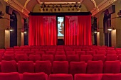 View of red chairs at Apollo Studio in Linden, Hannover, Germany